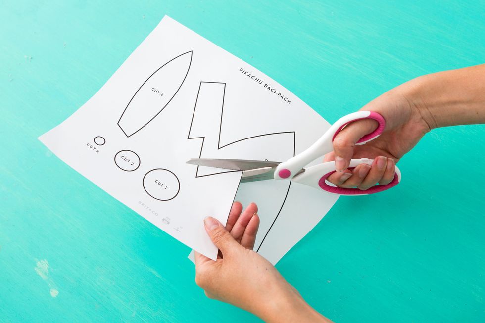 Cut out the shapes from the Pikachu backpack printable. Don't have one? Get it here: http://static.brit.co.s3.amazonaws.com/wp-content/uploads/2016/07/pikachu-backpack-printable.pdf