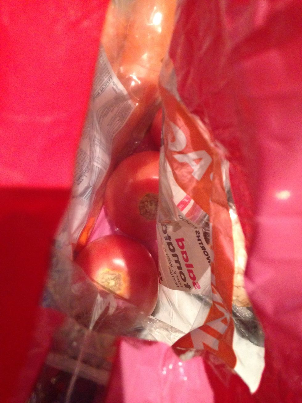 Cut out the stalks of the tomatoes and cut a cross into the skin at the base and top. Stab all over and place in a bowl and pour boiling water over to blanch.