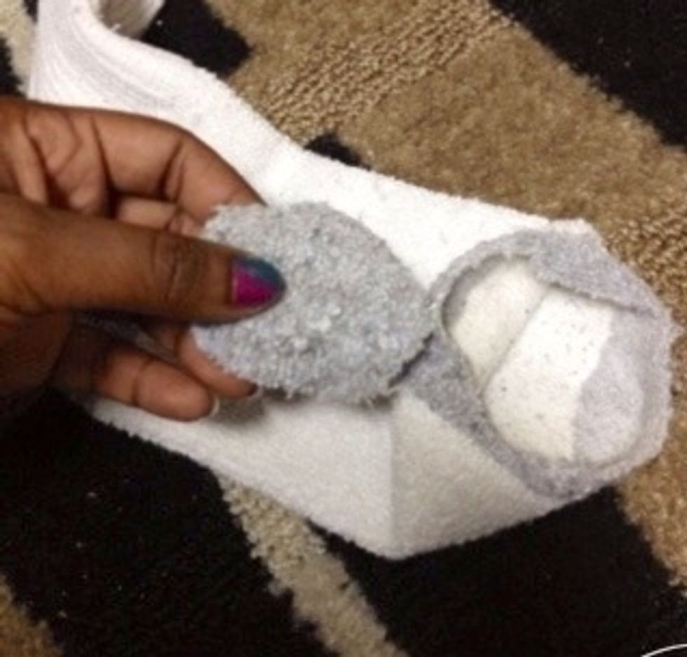 Cut out the toe part of your sock.
