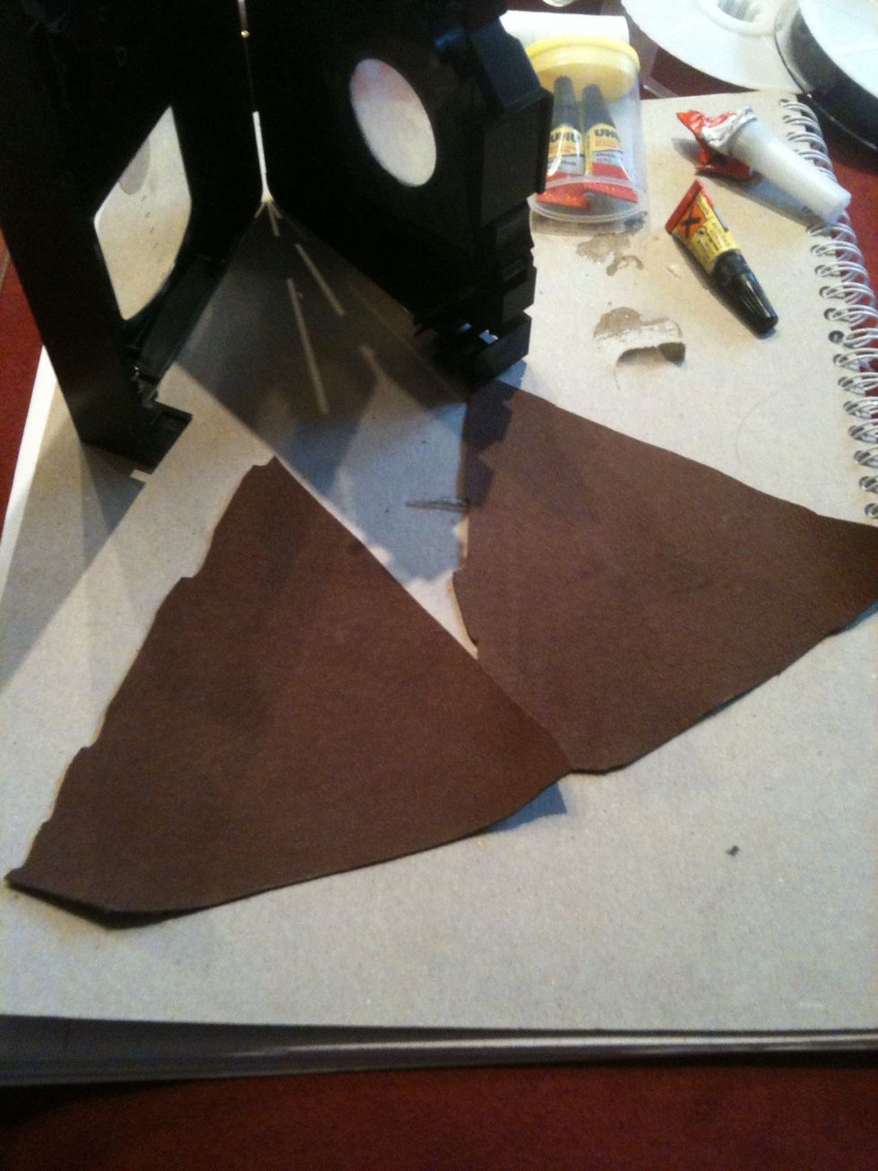 Cut out two equal triangles. You can use any fabric you want :)