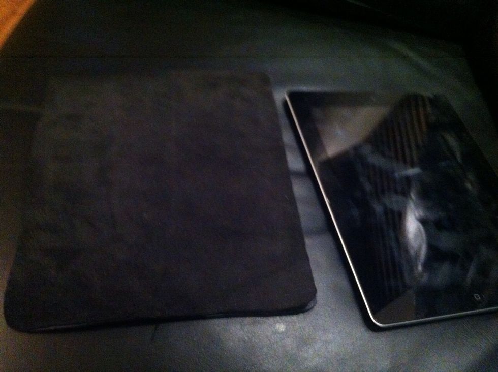 Cut out two pieces of leather, approx 5mm wider and longer than your tablet's front face. More if your tablet is fat.  Sew three sides, with the outside faces of the leather facing inward.