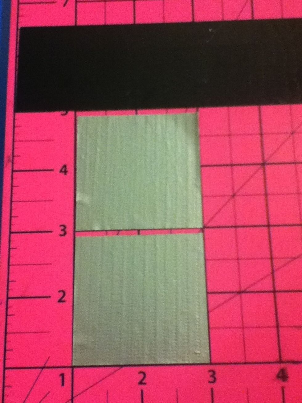 Cut out two squares that are 2x2 tape
