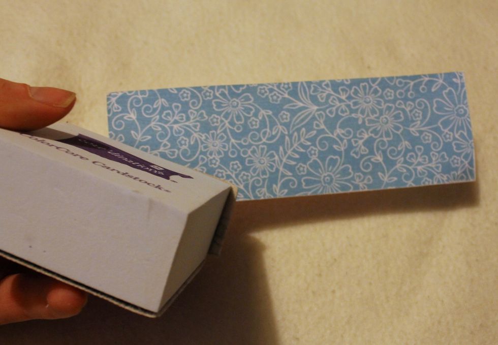 Cut out two strips of 5x2' from blue paper and sand the edges.