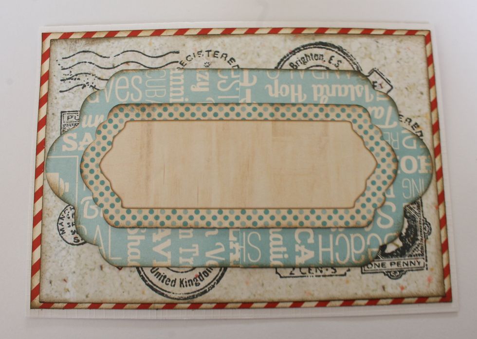 Cut out two tags with the largest die from the Nested Tags die set. Attach them in the middle of the card. Then attach a Noteworthy die-cut on top of the tags.