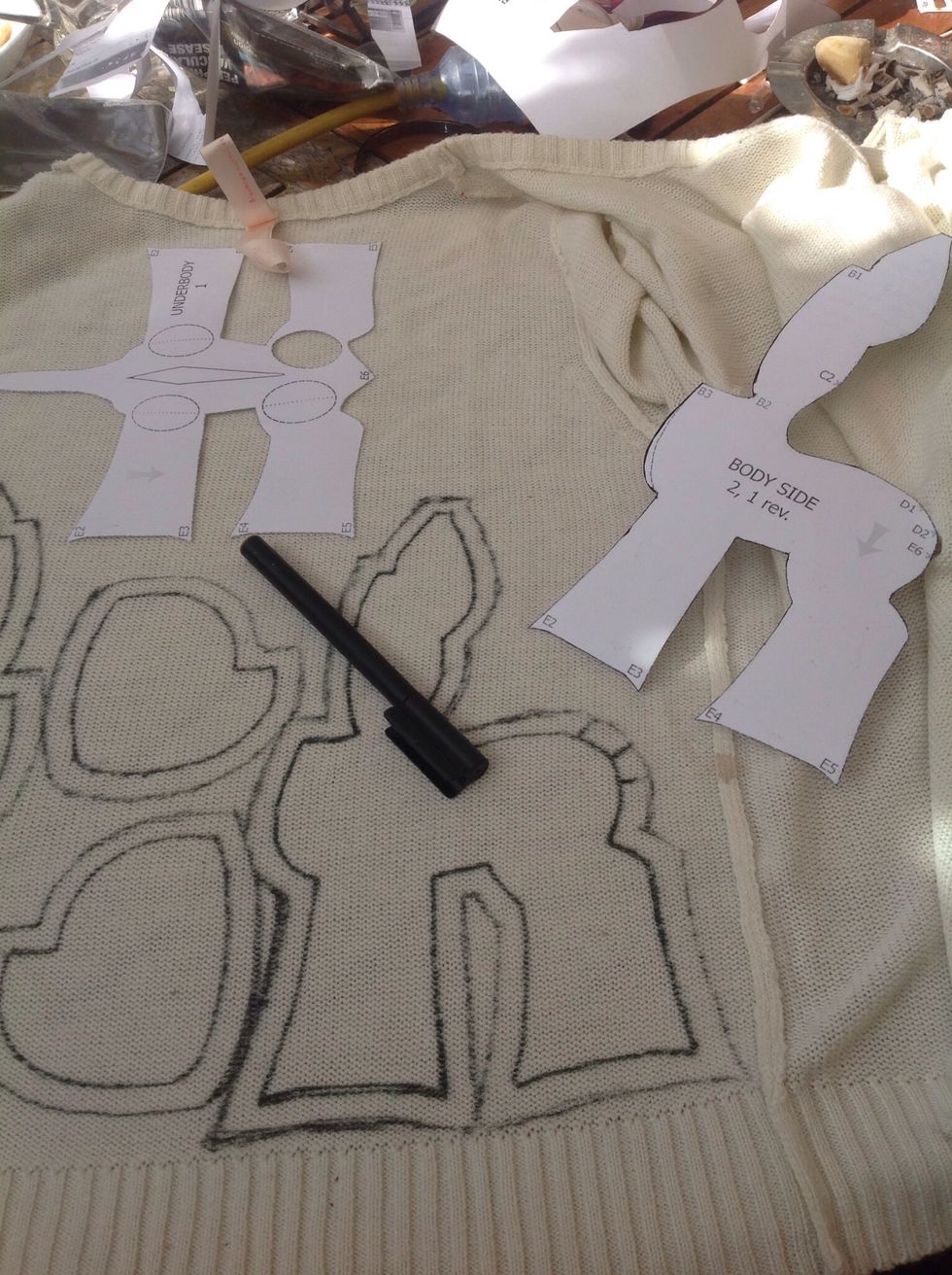 Cut out your pattern and trace it onto the fabric, make sure the lines in the fabric are in the direction you want and to leave enough space for the seam allowance, about 1/4 to 1/2 an inch.