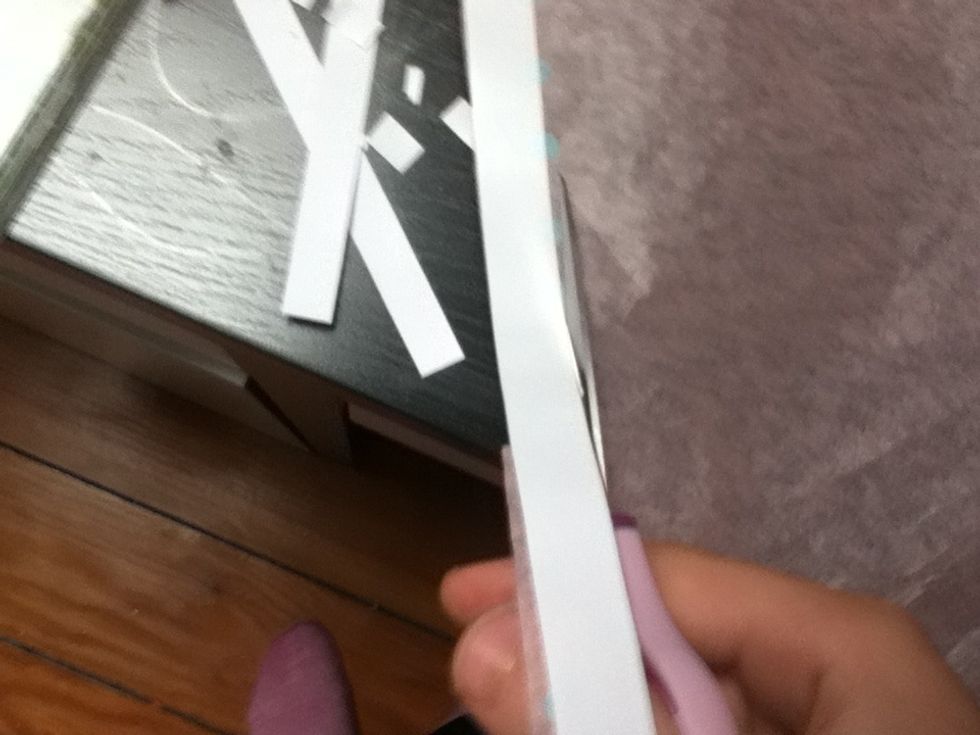 Cut out your taped section so that there are no ragged edges of tissue paper on the sides.