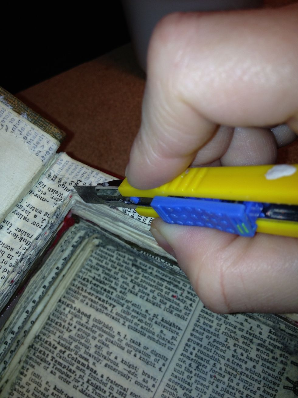 Cut pages of the book completely out, only leaving the boarder you marked. Use the same dimensions and mark a boarder along the second book's front cover, as you will be removing that as well.