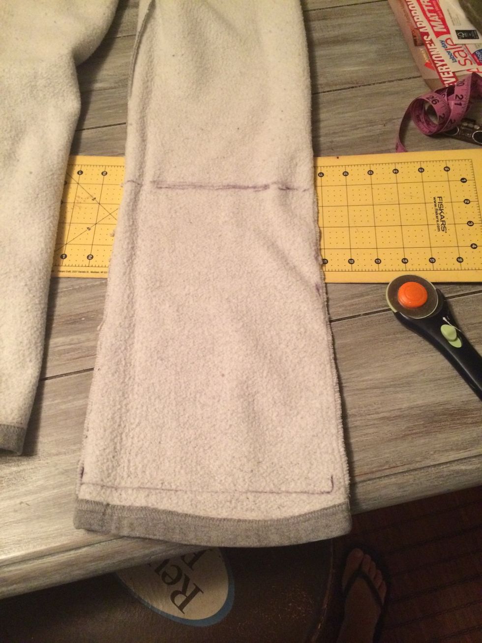 Cut pant leg with enough material to cover your measurements. Cut along seem to get 2 pieces from each leg. You can hem pants- which are now capris, use them for more projects or leave them as is.