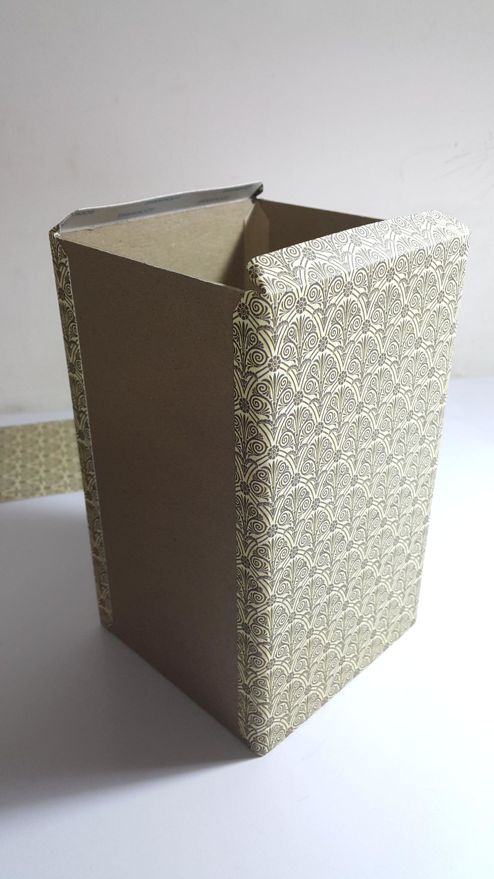 Cut paper 2pcs 5"(W)x8"(H) to cover the front and the back, left the top half inch for connecting with top part of the tower.