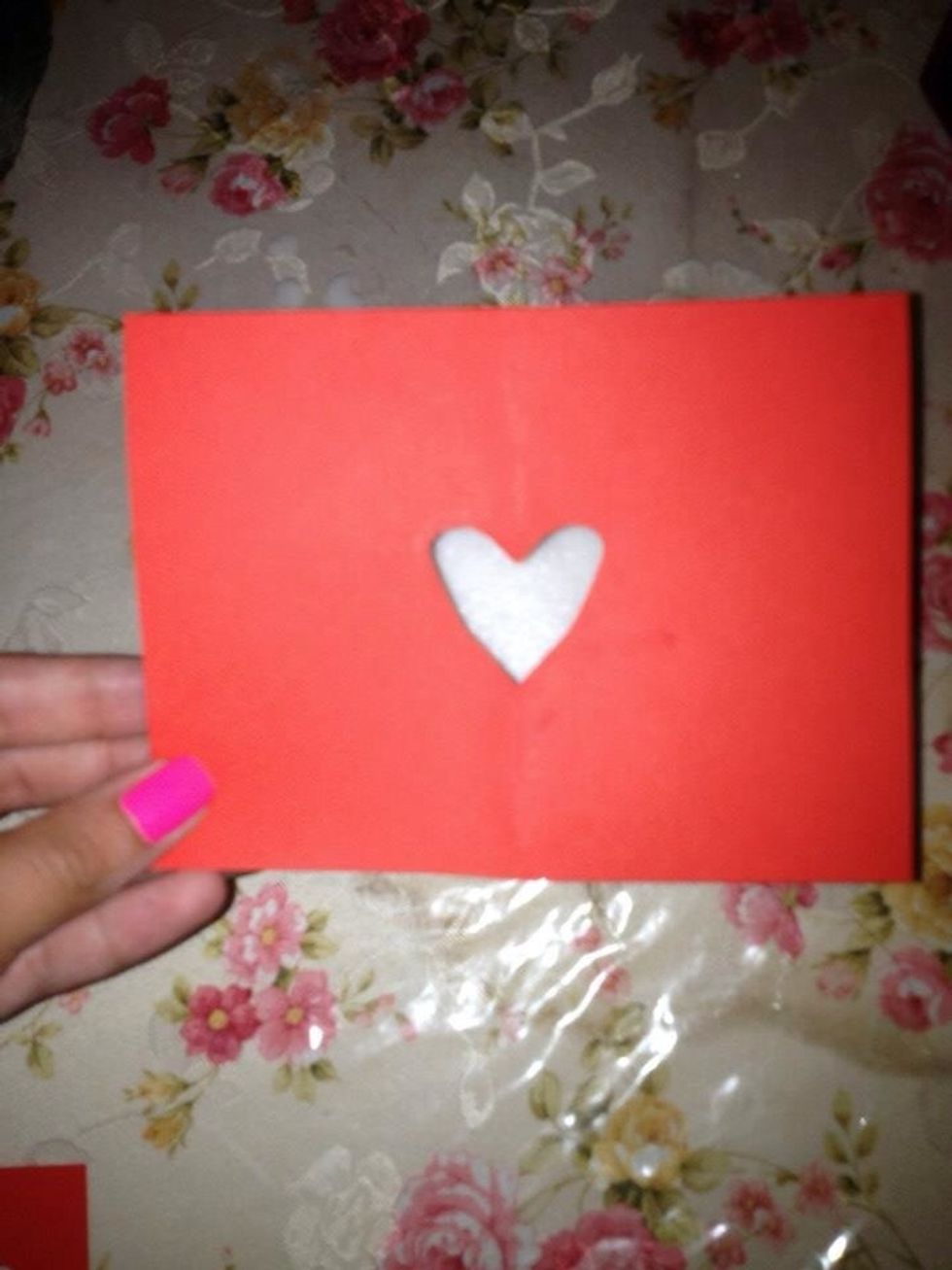 Cut paper in the shape of heart.