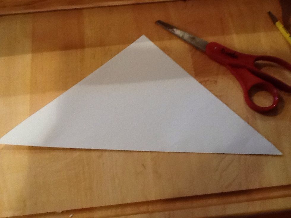 Cut paper into triangle.