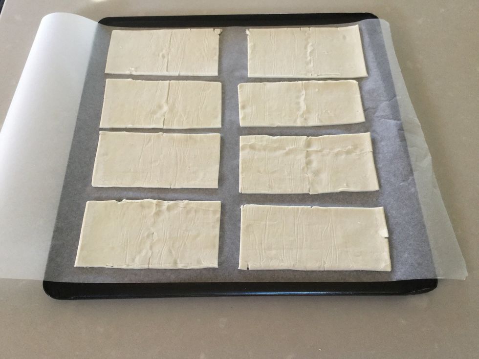 Cut pastry into 8 pieces and place in tray