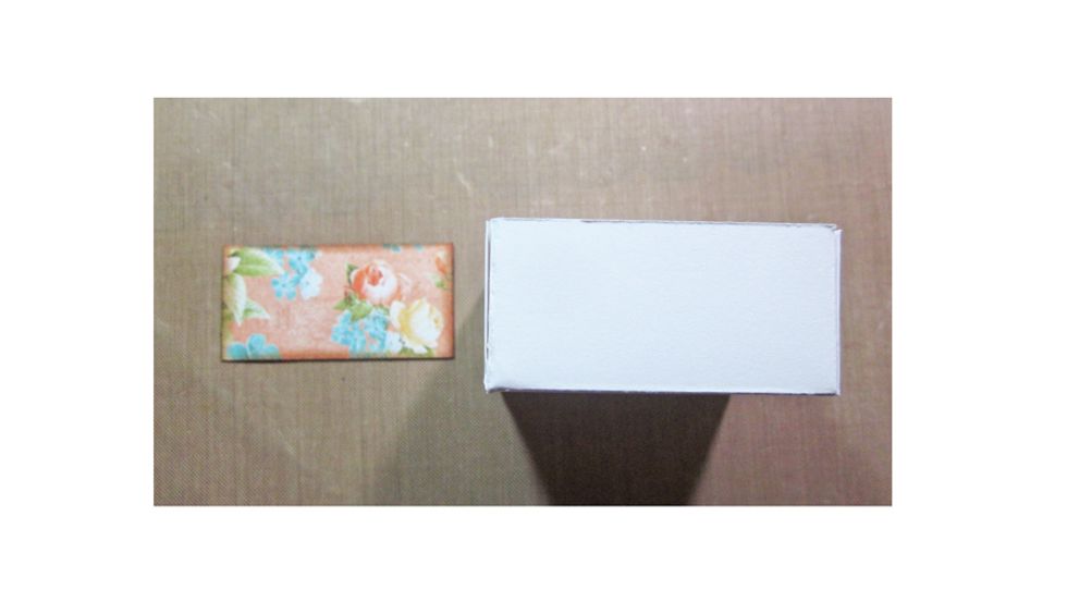 Cut patterned Graphic 45 paper 2 x 1" for the front of each drawer.