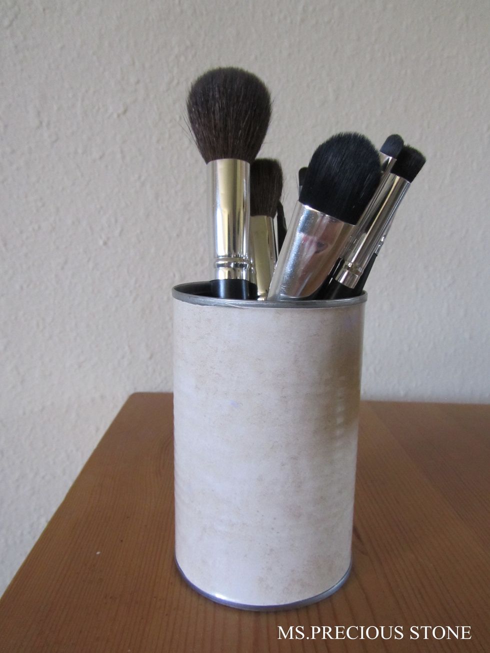 Cut, peel and attach it around the can. Here is the finish look. I use mine to hold my makeup brushes.