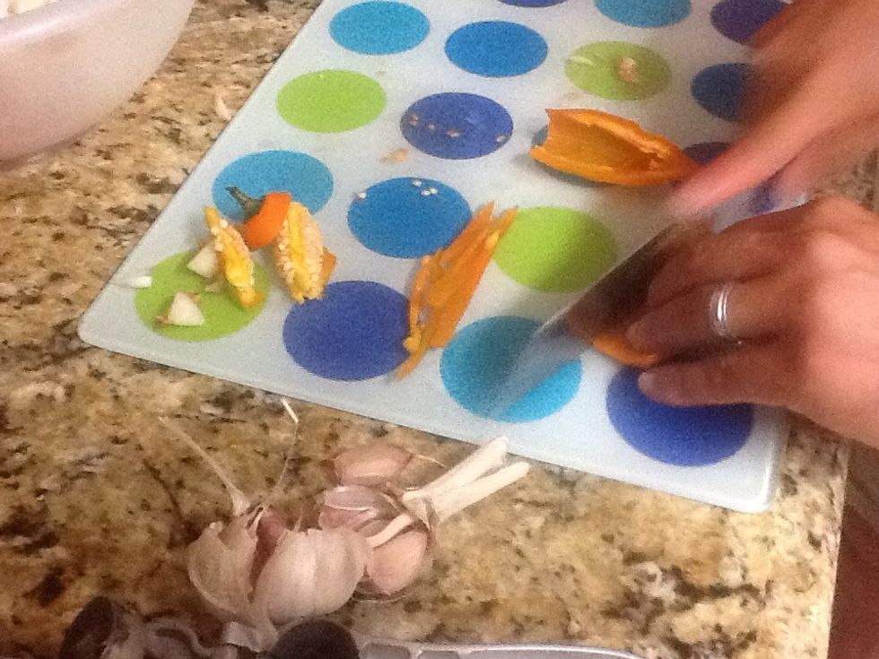 Cut pepper into thin strips.