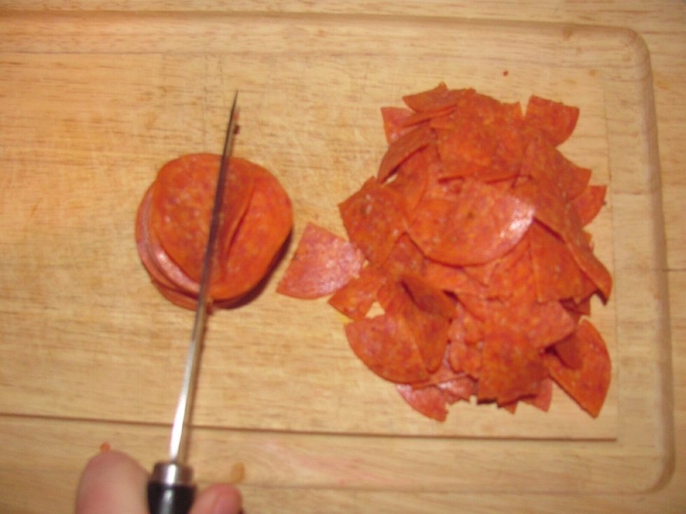 Cut pepperoni into fourths, making sure pieces are well separated