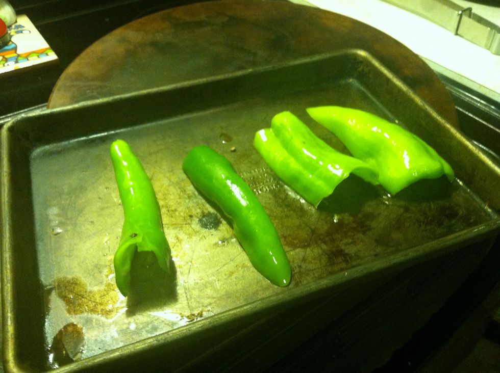 Cut peppers in half and take out the seeds, coat with olive oil.