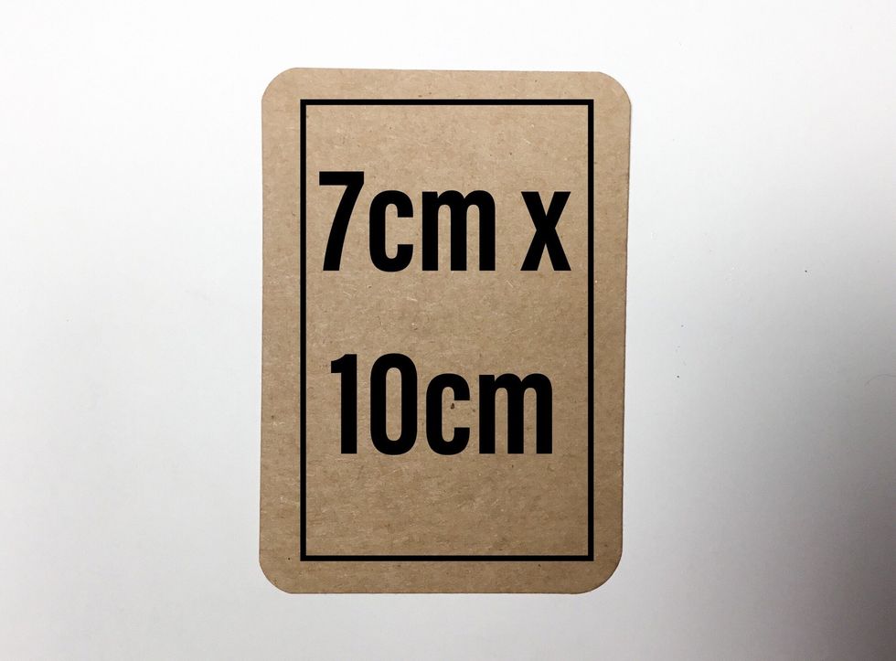 Cut pieces as shown from each tag measuring 10cm x 7cm and use a corner punch to round edges. These will become the mini album pages.