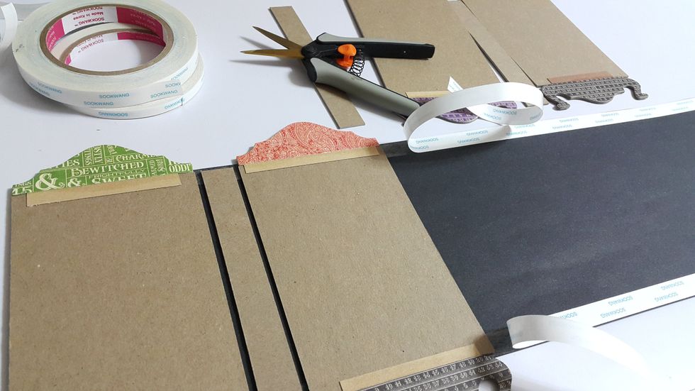 Cut pieces of black cardstock of 6-1/8" height, adhere the panels in orders, remember to leave a gab of at least 1/8" between chipboard