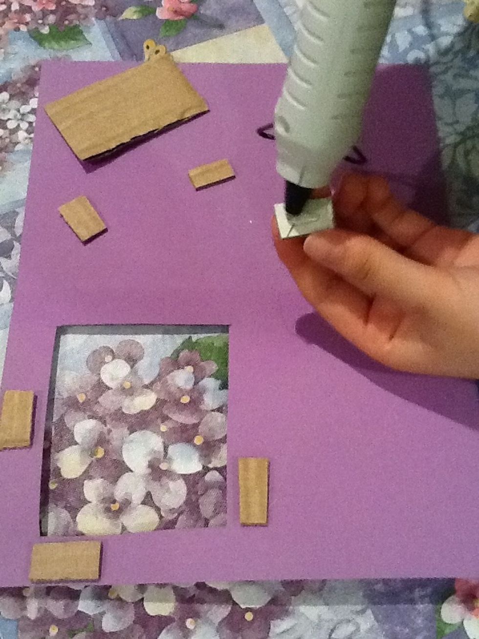 Cut pieces of cardboard into rectangles, glue and apply it to the inside of the card with the hole. You may stack more than one piece of cardboard on top of the other varying on the thickness desired.