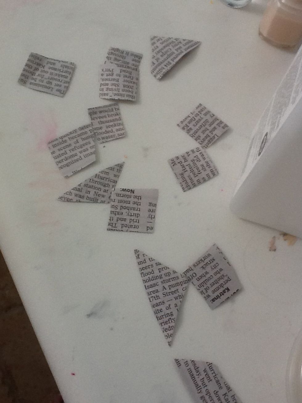 Cut pieces of newspaper up into squares just bigger than your nails