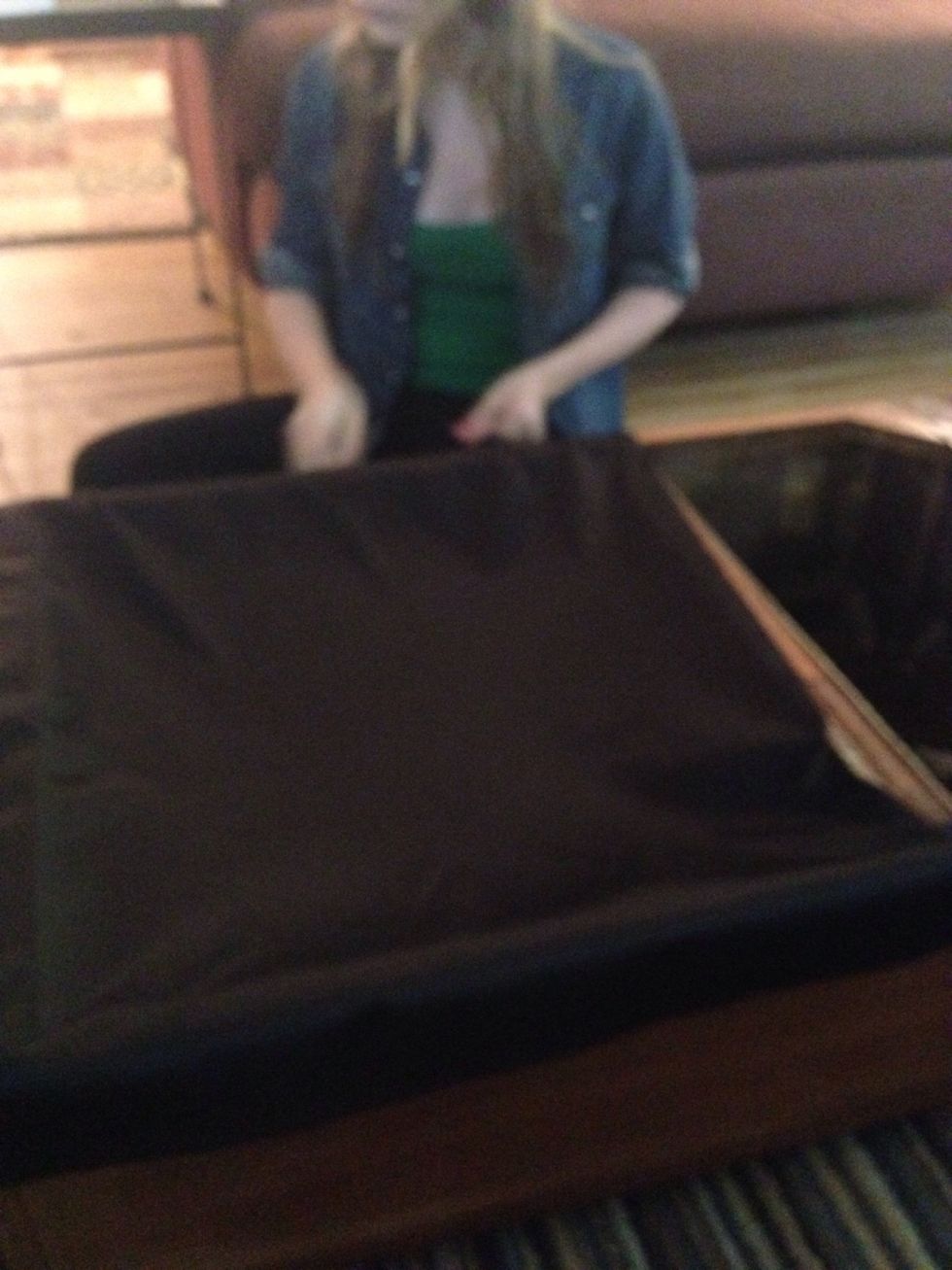 Cut pieces of speaker fabric and use staple gun to pull it tight. Start at the center and work your way to the sides.