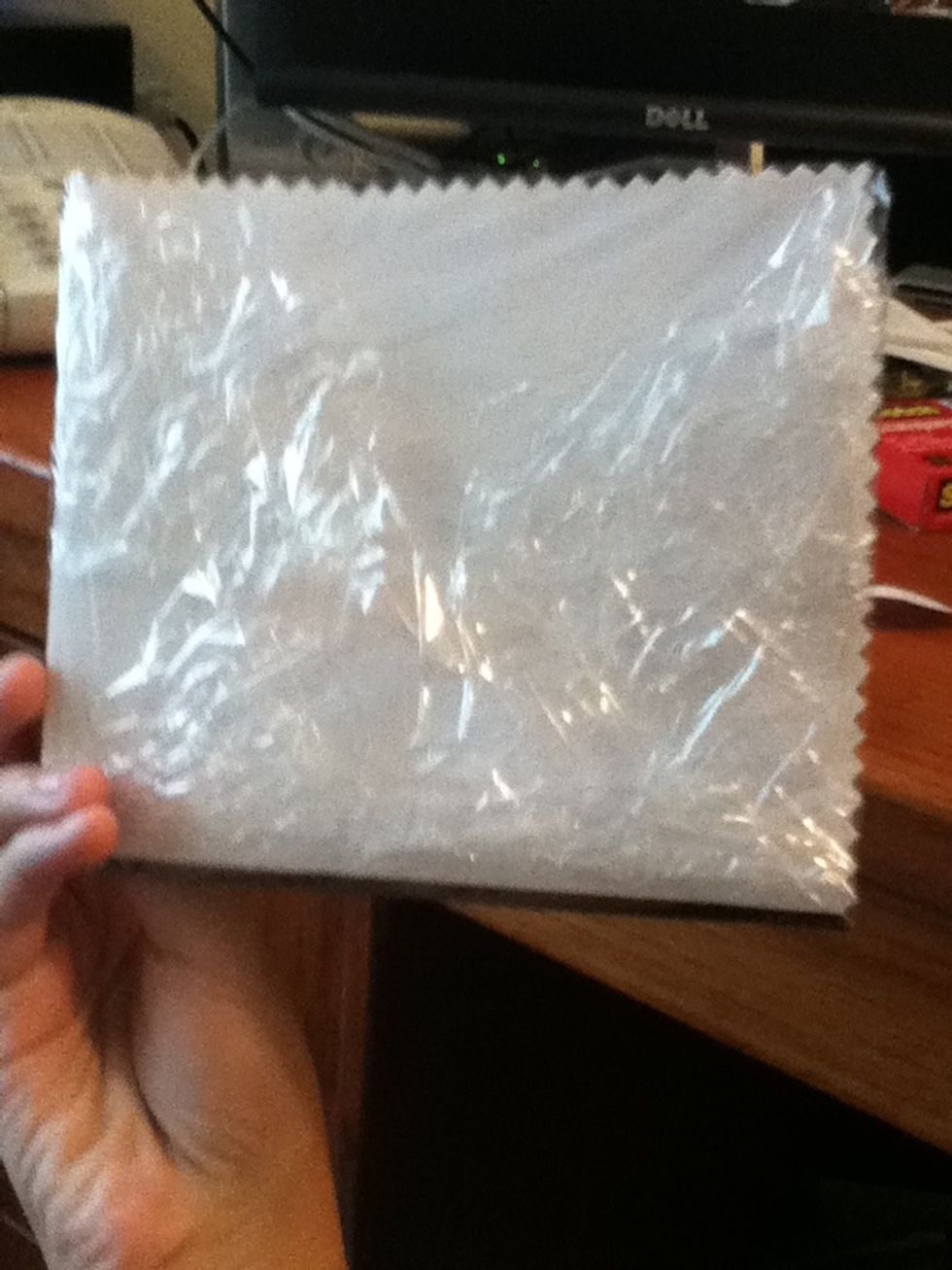 Cut plastic wrap to big for coaster and fold in the back, smooth in the front.