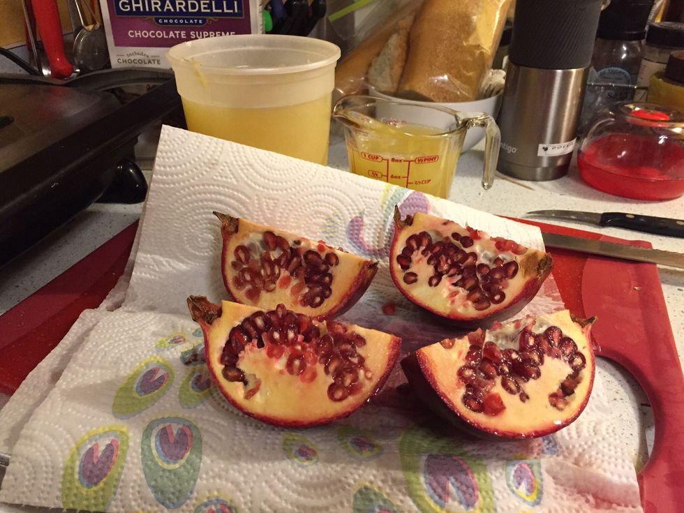 Cut pomegranate in four parts.