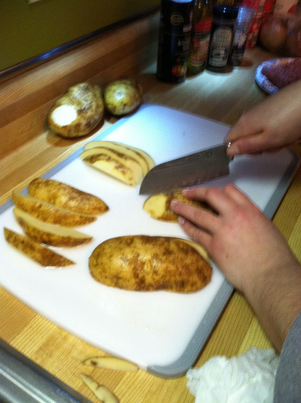 Cut potatoes in half long way. Then cut each half into quarters. (Sorry about the blurry photos!)