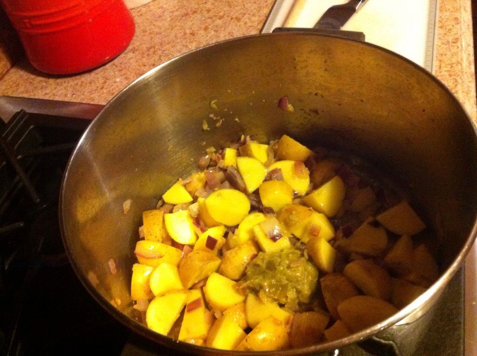 Cut potatoes into 1/2 inch dice, and add to pot along with cumin, salt and pepper. Cook for another 5 minutes.