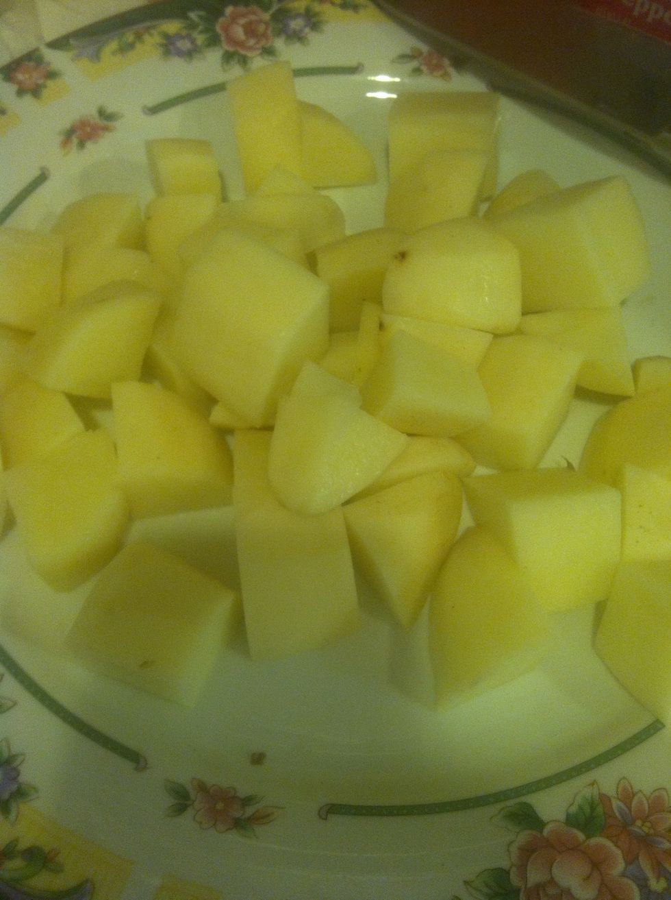 Cut potatoes into small cubes for faster cook and add into pot.