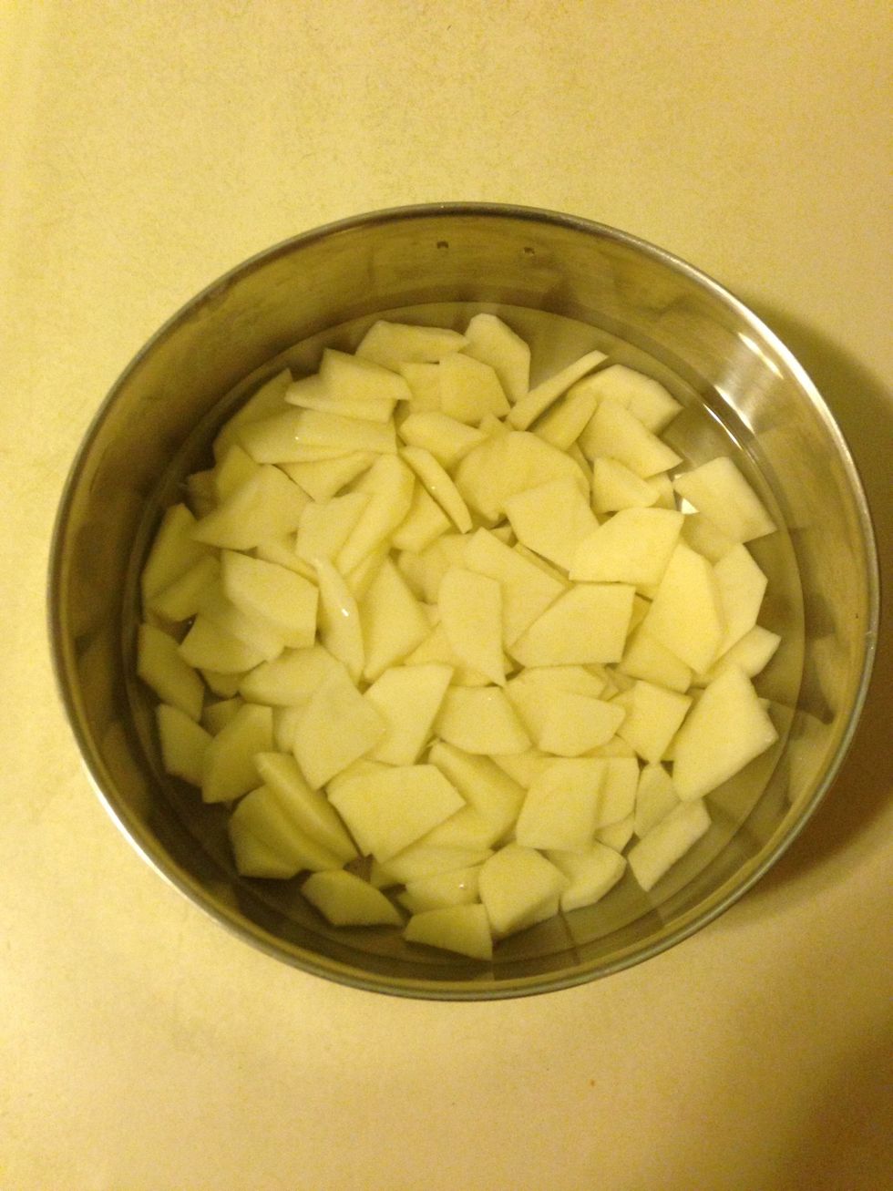 Cut potatoes into small quarters and let them soak prior to preparing the rest of the ingredients.