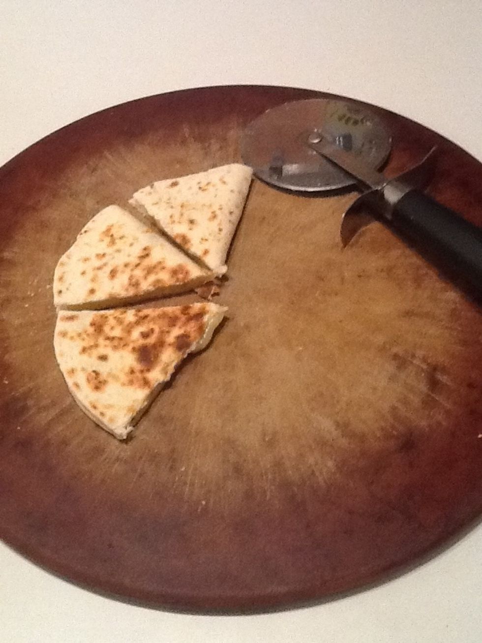 Cut quesadilla into thirds. I use a pizza cutter to make this task easier.
