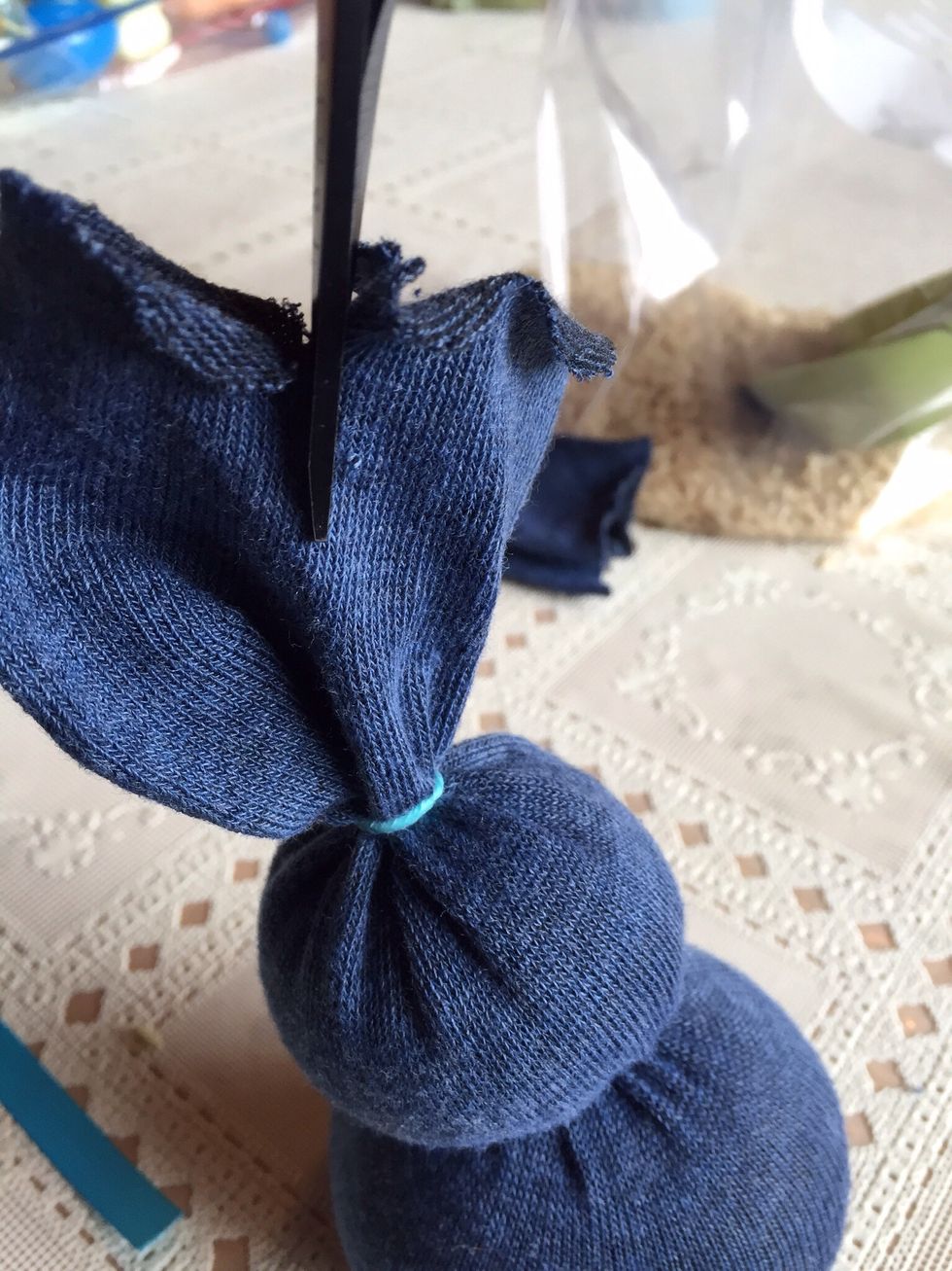 Cut remaining piece down the middle to form two ears.