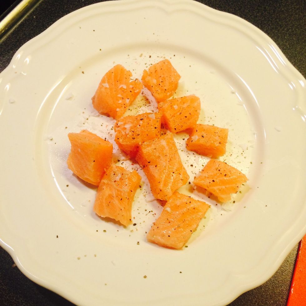 Cut salmon filet in squares. Season with salt and pepper.