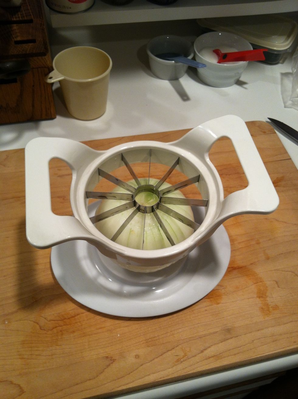 Cut sections with a knife, or just use this bad boy... Which turns out to be an apple slicer. Don't cut all the way through...