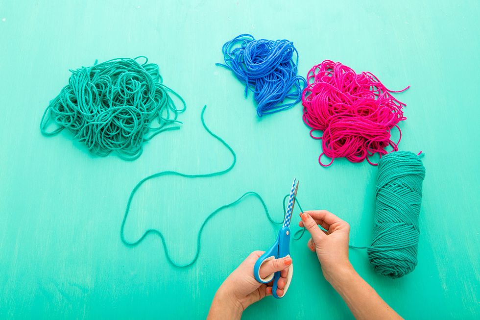 Cut several lengths of yarn about 3 ft long.