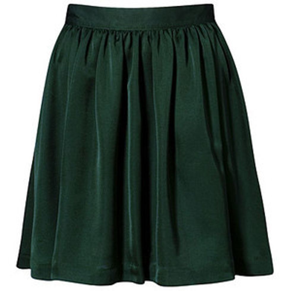 Cut skirt down the middle but not all the way stop at the elastic band.