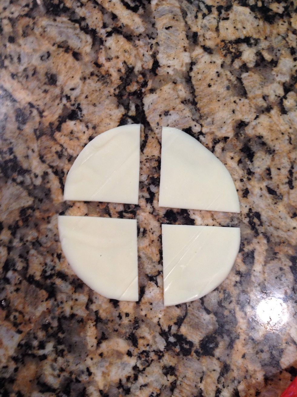 Cut sliced cheese into 4's so that it will fit onto roll better. I used smoked provolone but you can substitute swiss or whatever your liking