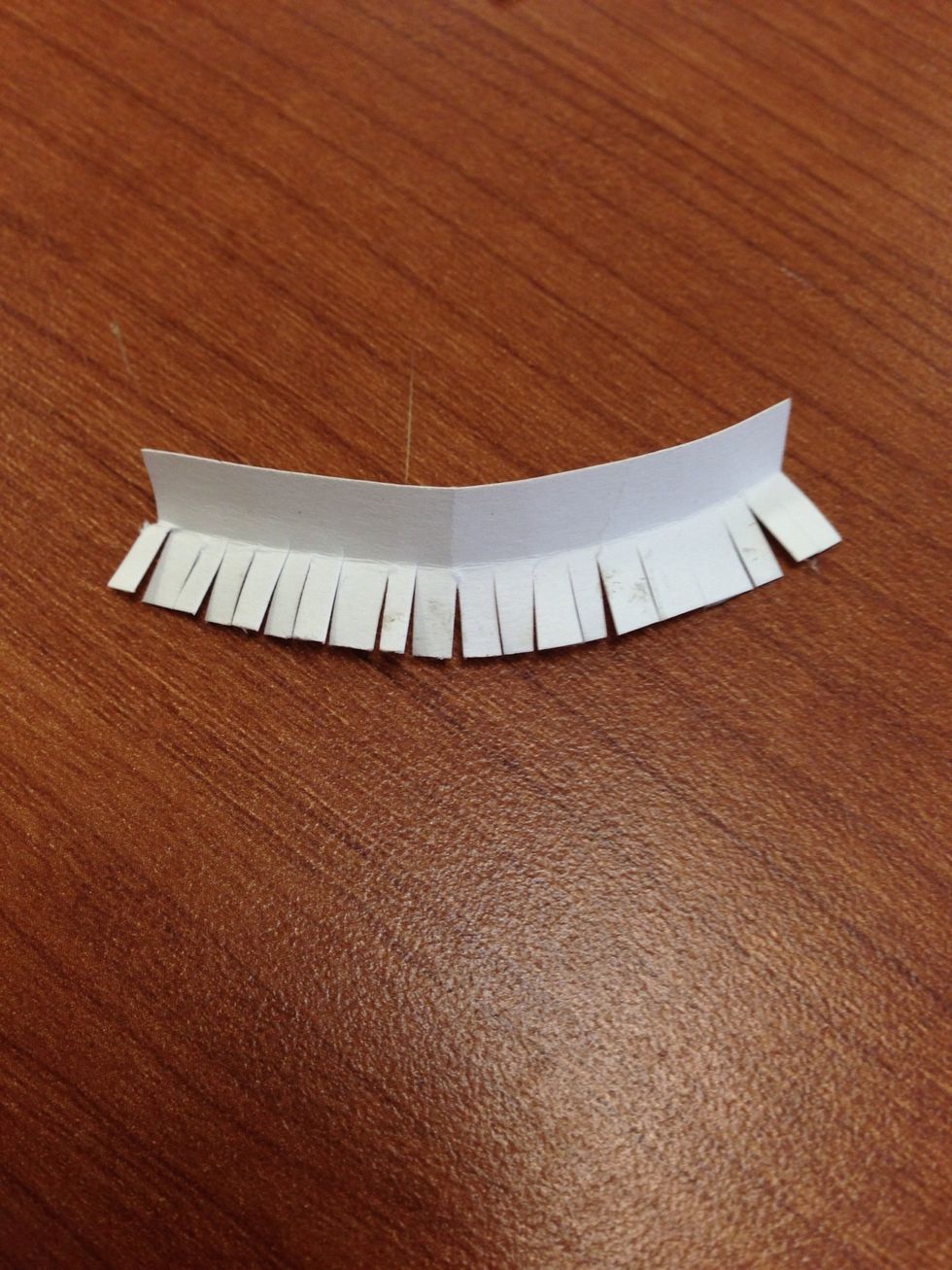 Cut slits in paper to be able to go around curved edges