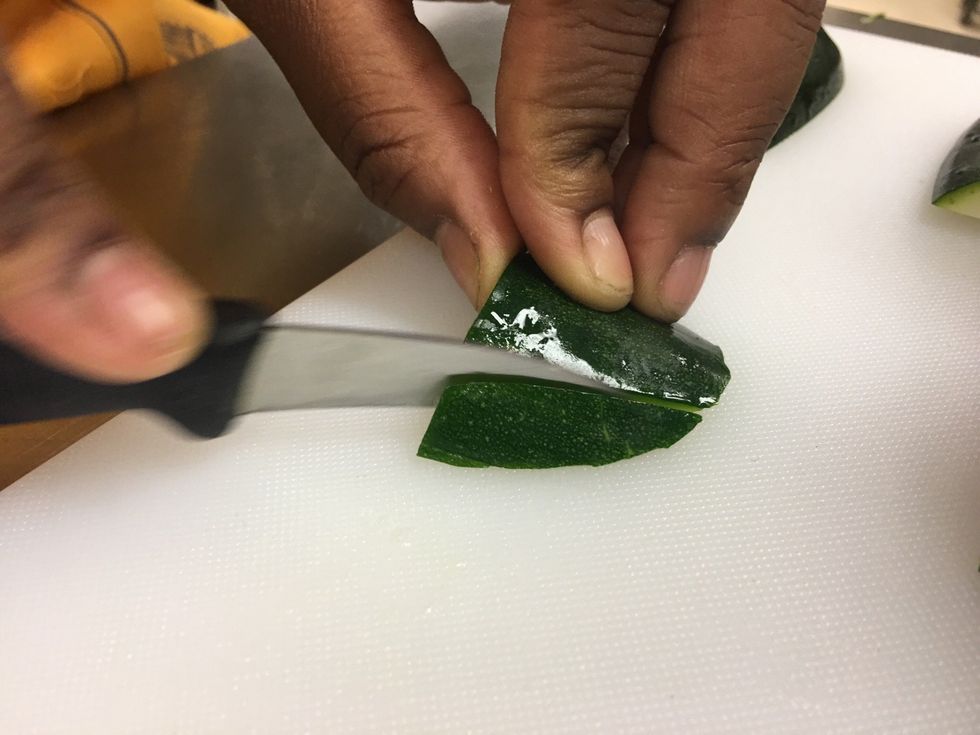 Cut small diagonally pieces on both sides closer to the edge. Leaving the middle.