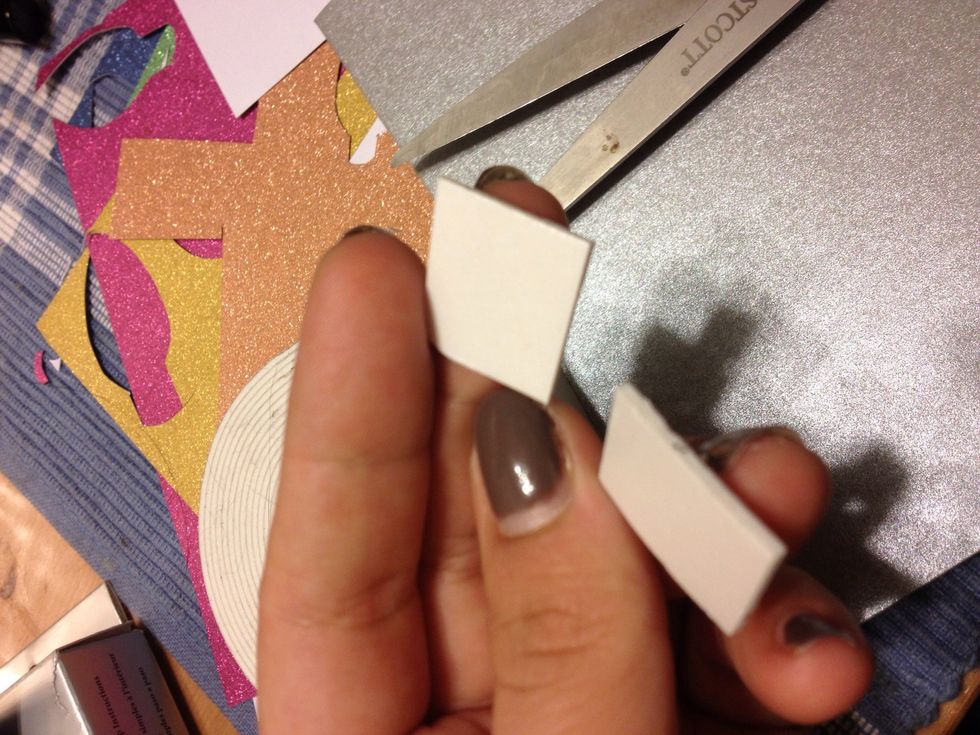 Cut small pieces of foam tape. This makes the shapes pop out from the card.