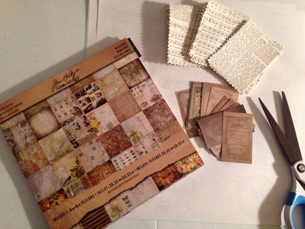 Cut small squares from Tim Holtz's 8x8 Menagerie Paper.