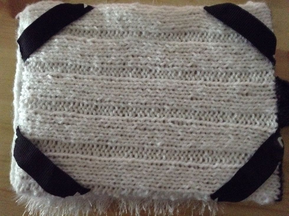 Cut small strips of elastic and sew them to your corners.