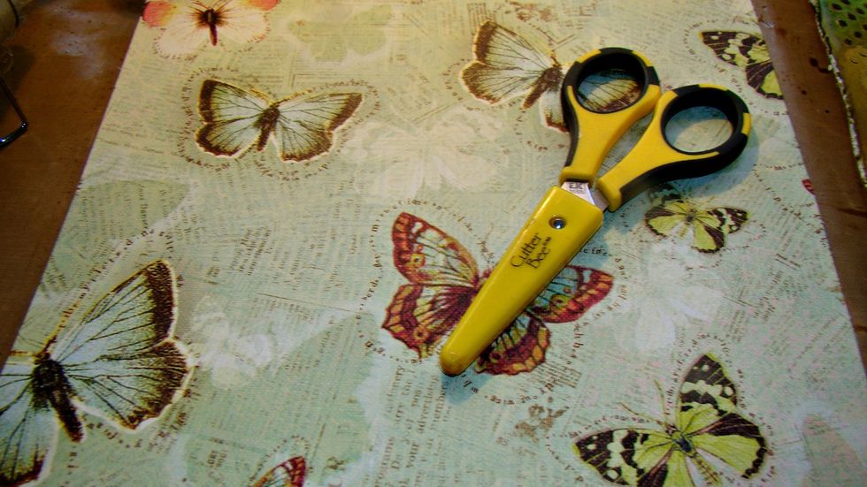 Cut some butterflys out of other scrapbook paper to add as embellishments to my page.