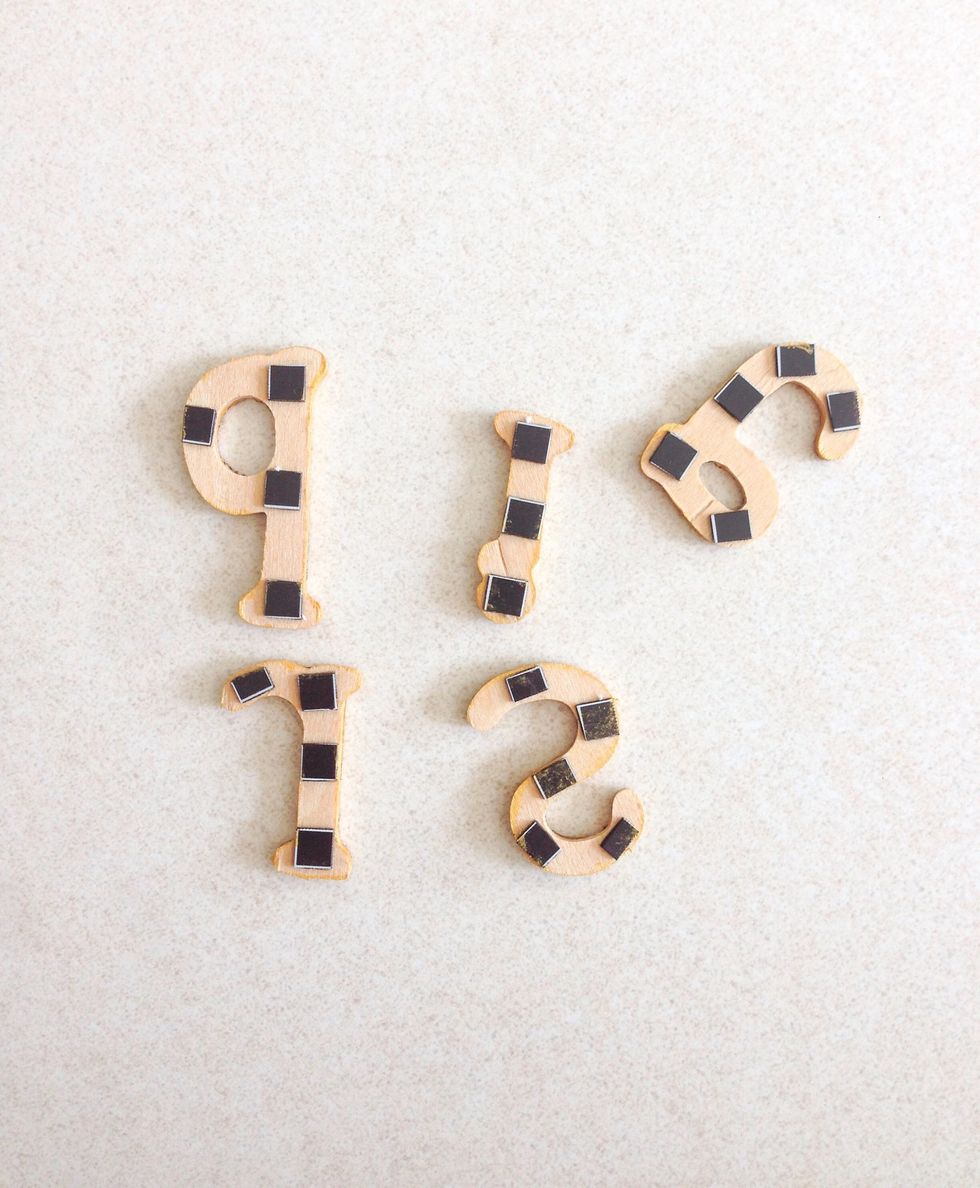 Cut some self-adhesive magnetic sheets into smaller sizes and stick onto the back...