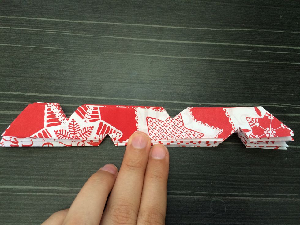 Cut some small triangles on the edge of the folds.