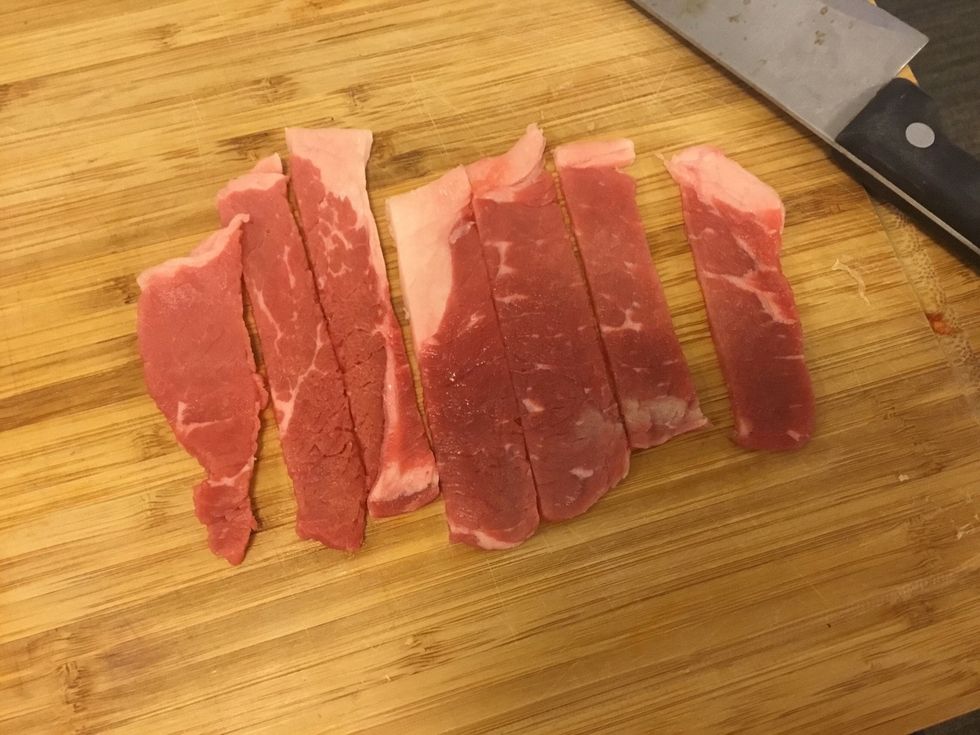 Cut steak into 1cm strips (I bought thin steak, you can use thick steak or mallet the steak out)
