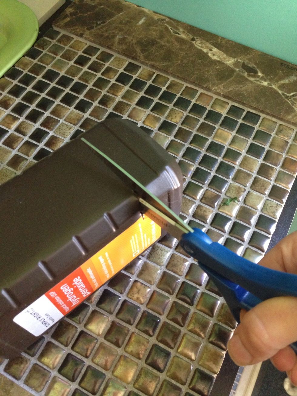 Cut straight across the bottle one time.