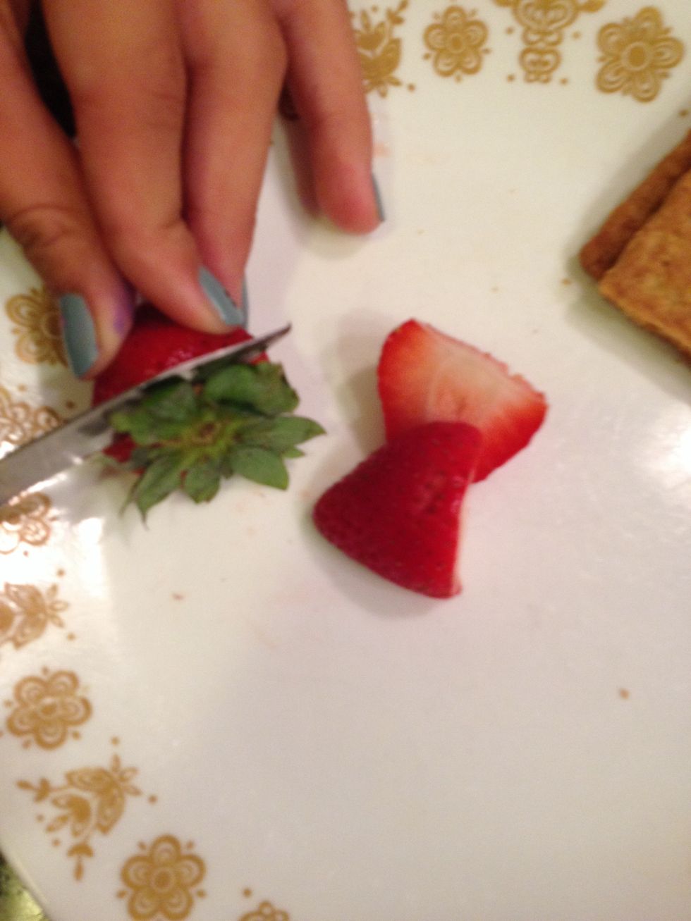 Cut strawberries in half \ud83c\udf53
